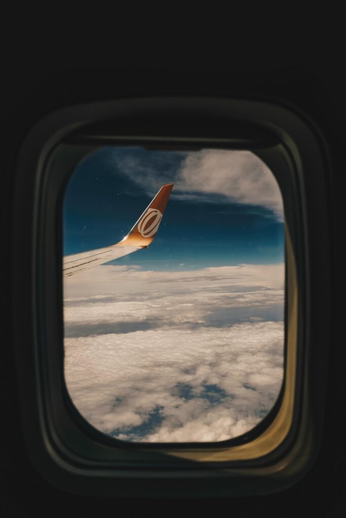 pexels-photo-682406-682406 View of clouds and airplane wing from a window seat, offering a tranquil travel experience.